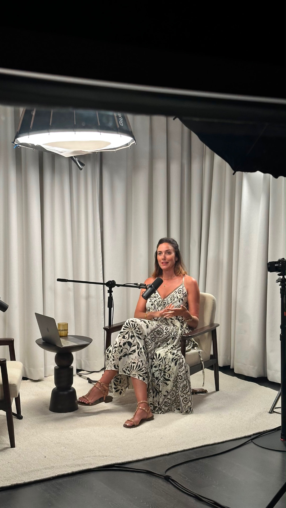 Susanna recording an episode of A Portfolio Life, speaking into a studio microphone
